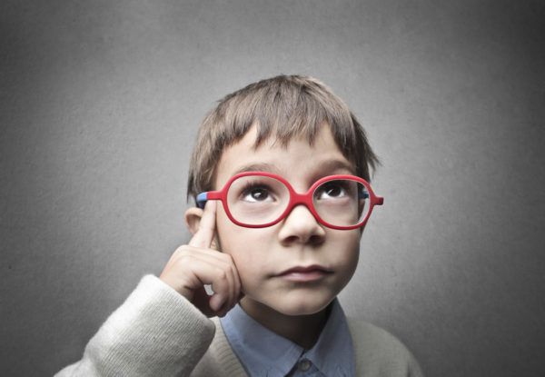 ADHD ADHD - Young kid pointing to temple wearing large red glasses