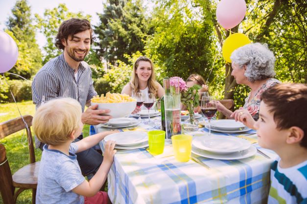 family of three generations at a garden party